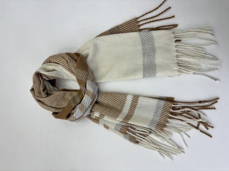 Folded camel, cream, and grey plaid woven scarf with twisted fringe ends on white background