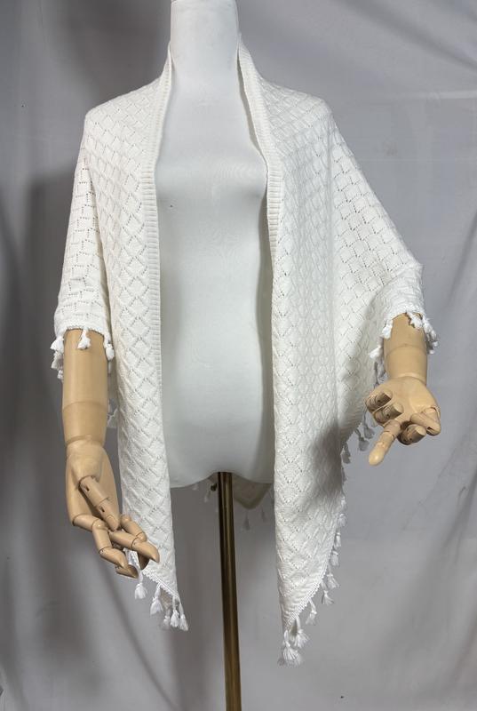 Ivory open-front diamond knit wrap shawl with white tassel fringe trim displayed on a dress form mannequin