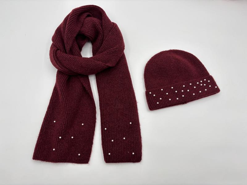 Burgundy ribbed knit winter scarf and beanie hat set with scattered pearl bead details on white background