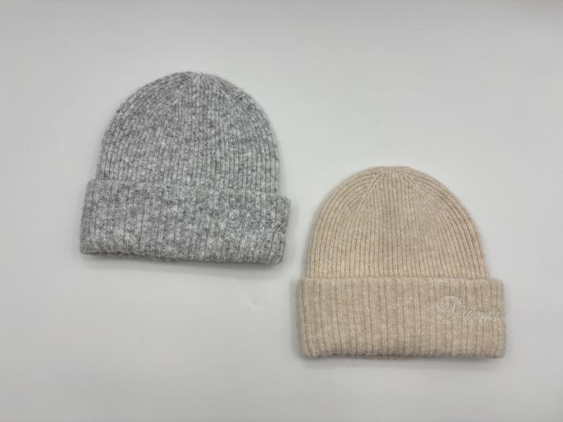 Two ribbed knit wool blend beanie hats with folded cuff, one in heather grey and one in cream beige, shown on white background