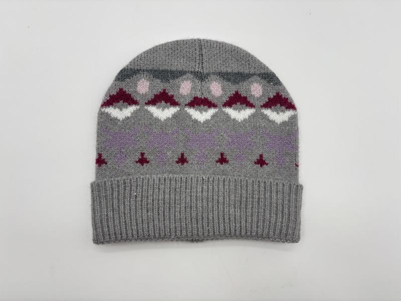 Grey knitted beanie hat with Fair Isle pattern featuring burgundy, white, pink and lavender geometric motifs and ribbed cuff
