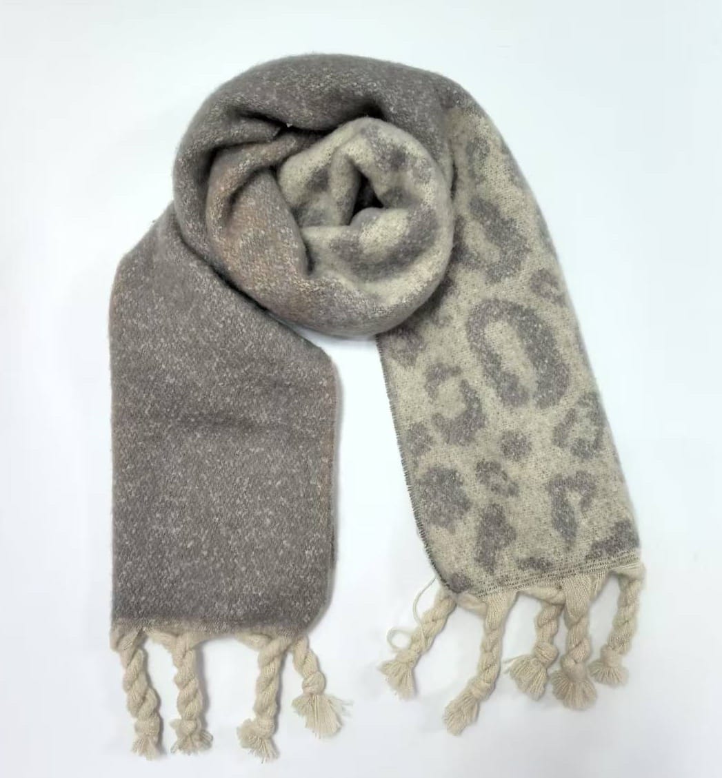 Soft reversible scarf with leopard animal print on one side and solid grey on the other, with braided tassel fringe ends