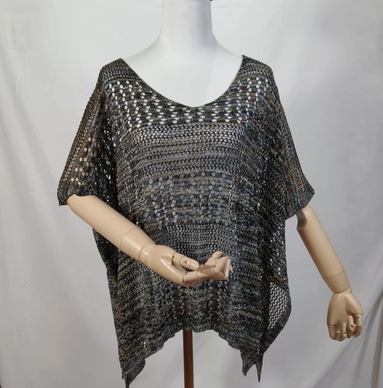 Dark multicolor open knit crochet poncho top with short sleeves and asymmetric hem displayed on mannequin