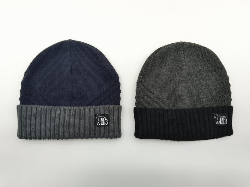 Two knit beanies side by side: navy blue with grey ribbed cuff and charcoal grey with black ribbed cuff, both with New York 93 label