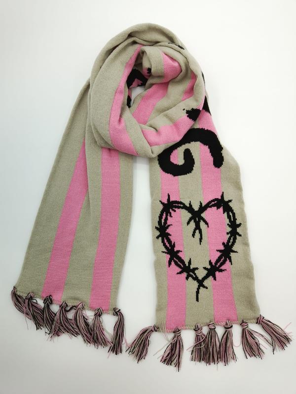 Knitted beige and pink striped scarf with black barbed wire heart graphic and tassel fringe ends