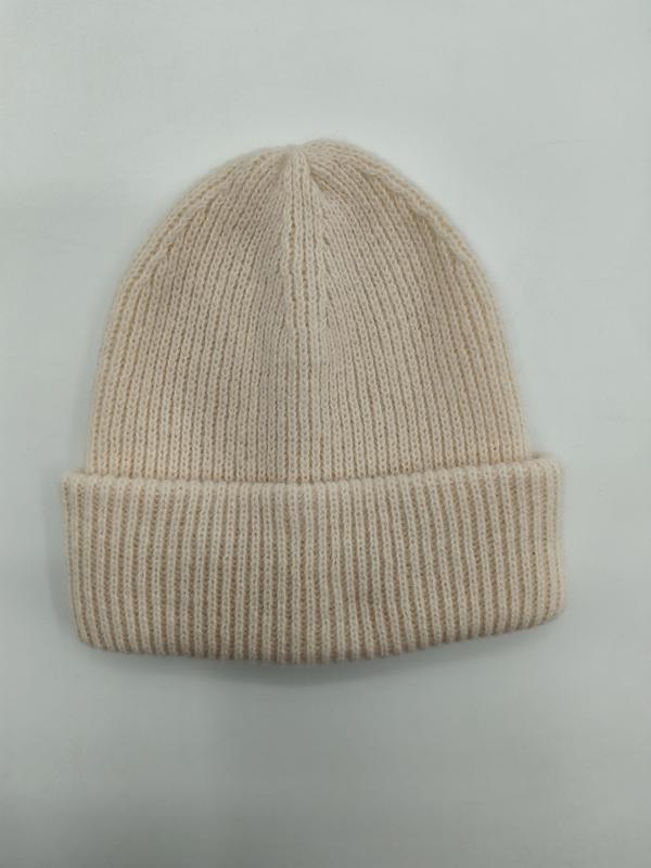 Cream off-white ribbed knit cuffed beanie hat laid flat on white background, soft wool blend winter hat