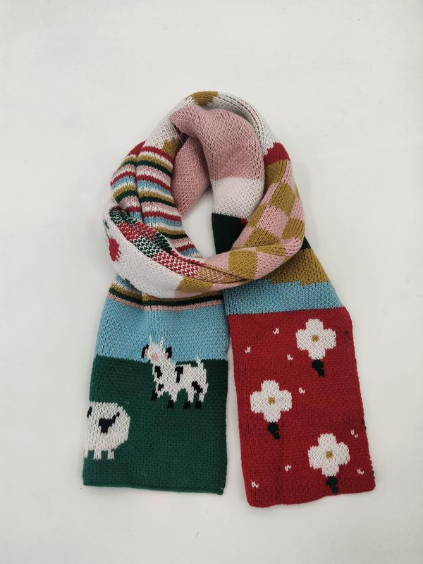Colorful knitted scarf with sheep motifs, floral blocks, stripes, and patchwork panels in red, green, blue, and pink