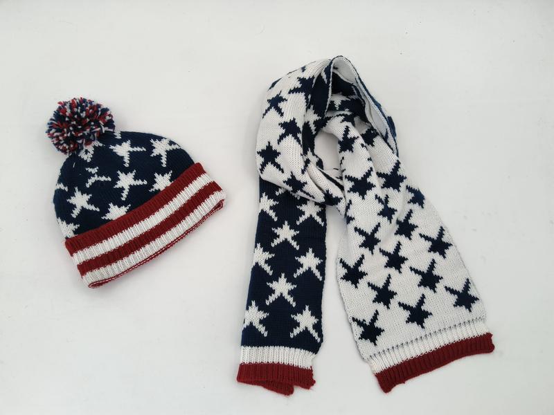 Knit patriotic beanie hat with pom-pom and matching scarf featuring star pattern in navy, red, and white
