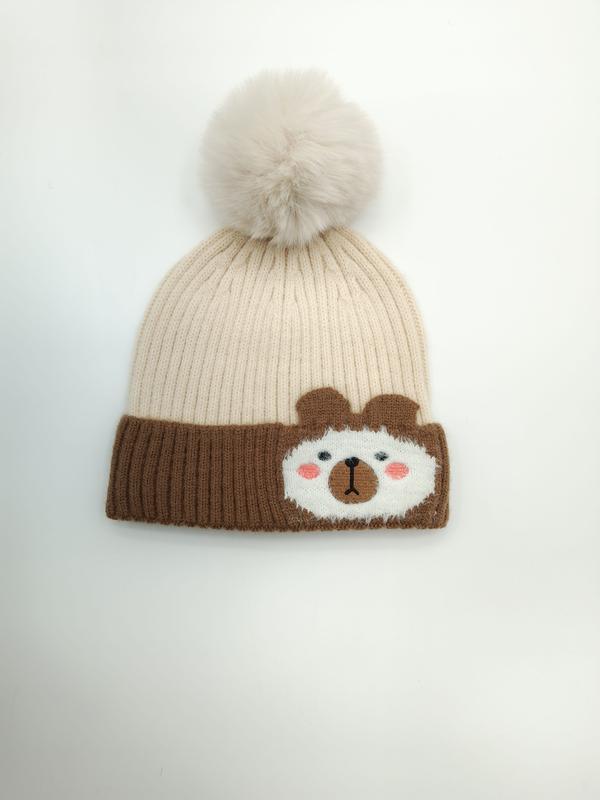 Cream and brown ribbed knit kids beanie hat with fluffy pom-pom and cute bear face patch on cuff